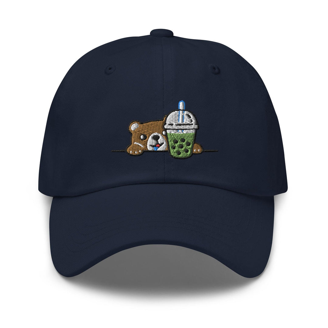 a baseball cap with a bear and a cup of coffee