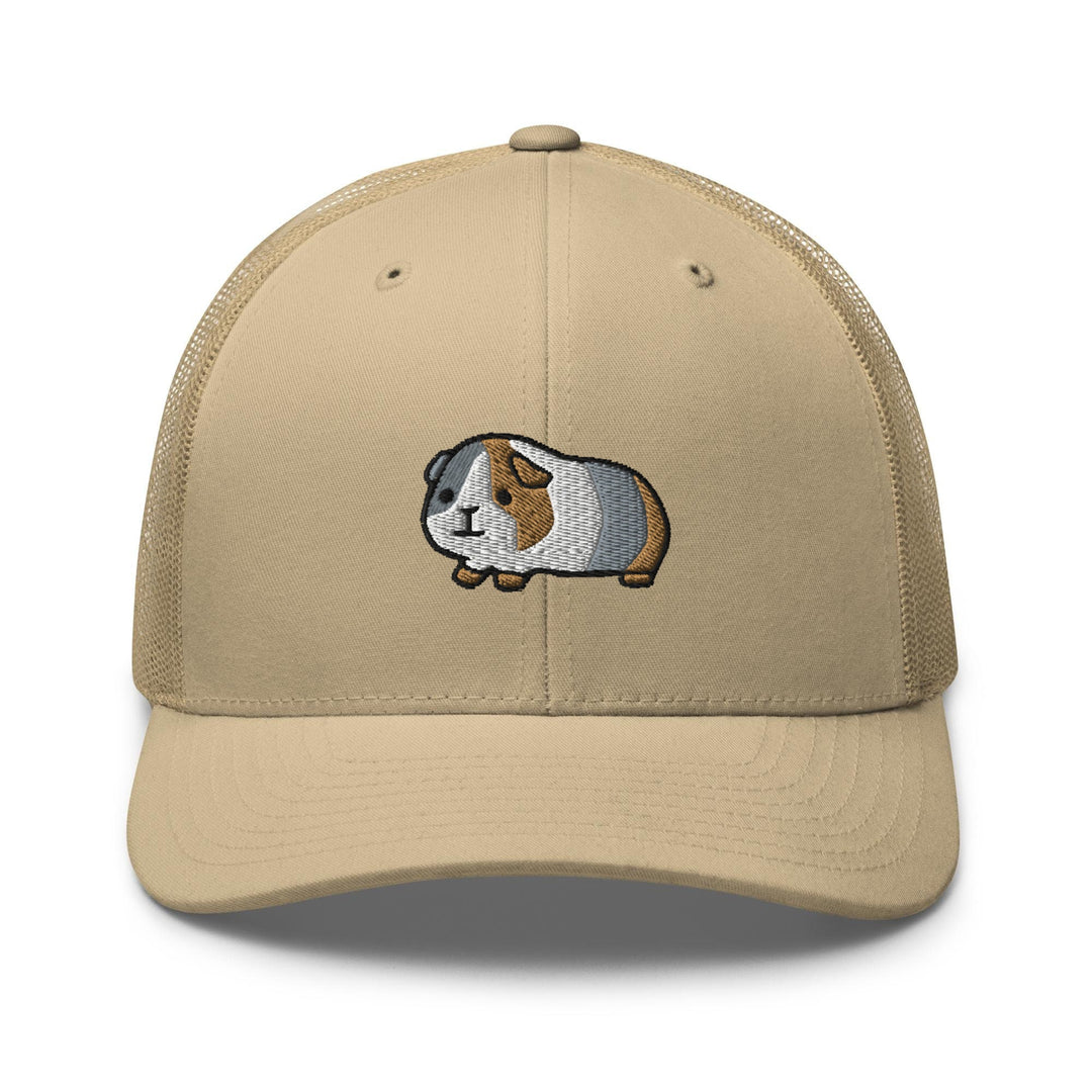 a tan cap with a guinea pig embroidered on the front