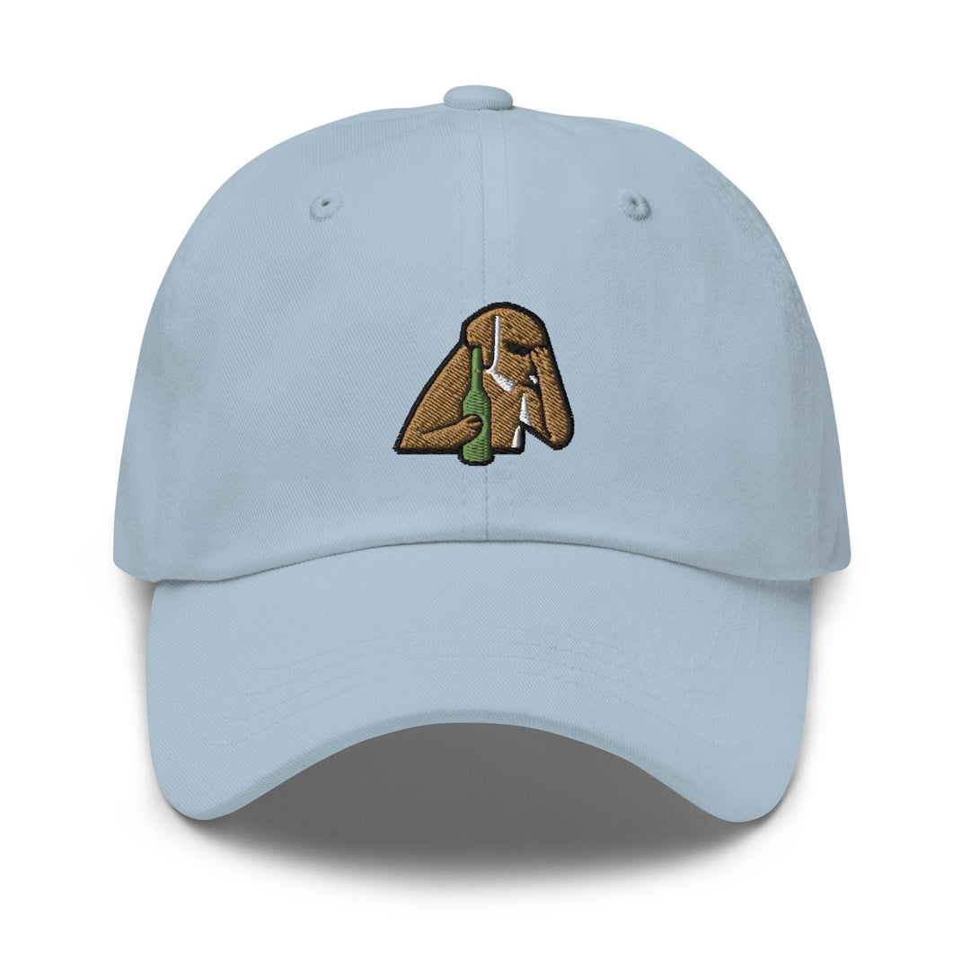 a light blue hat with a picture of a dog holding a bottle of beer