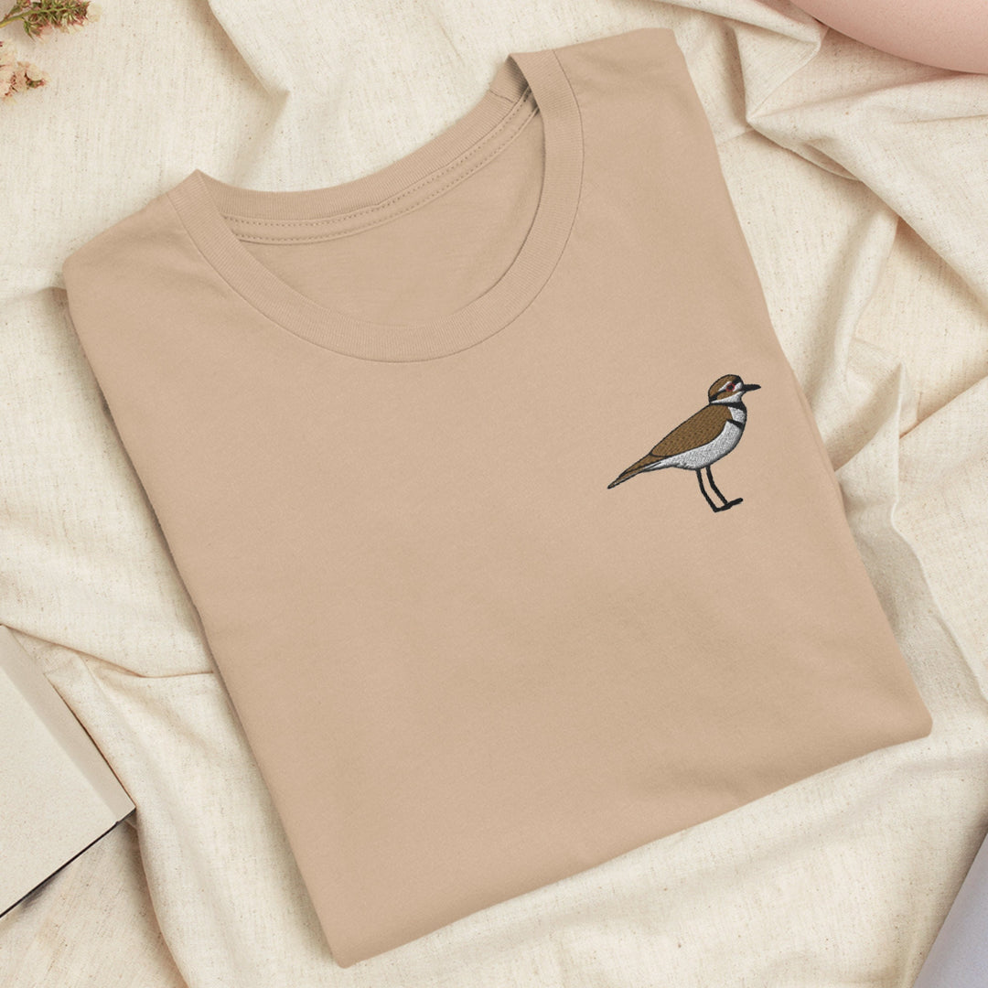 a t - shirt with a bird embroidered on it
