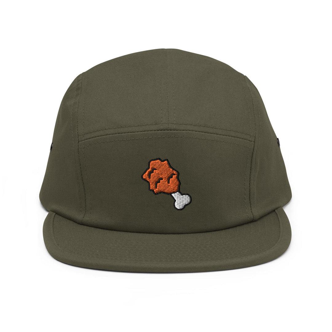 a green hat with an orange bear embroidered on it