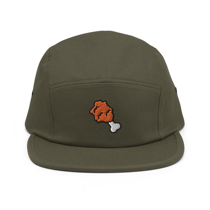 a green hat with an orange bear embroidered on it