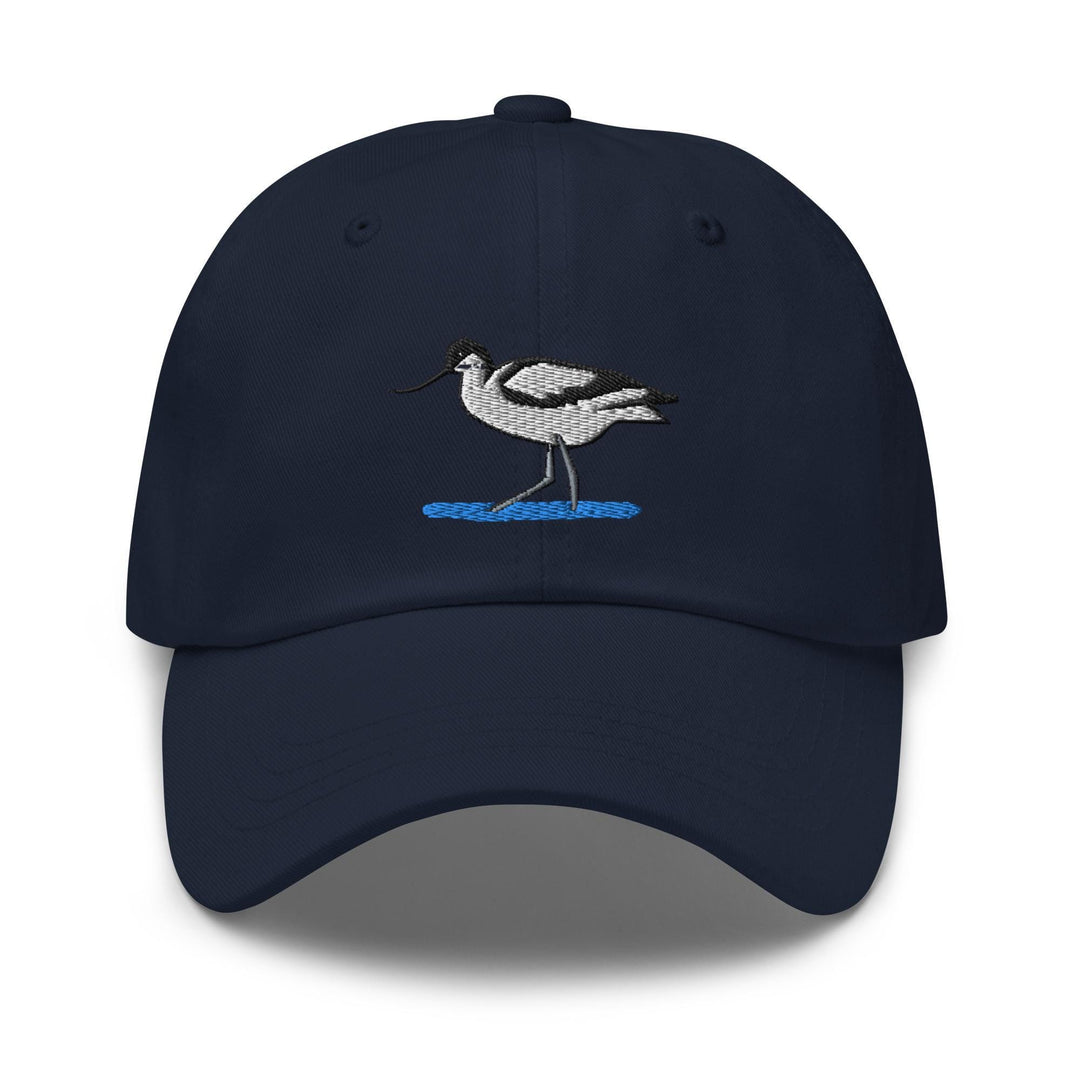 a navy blue hat with a bird embroidered on it