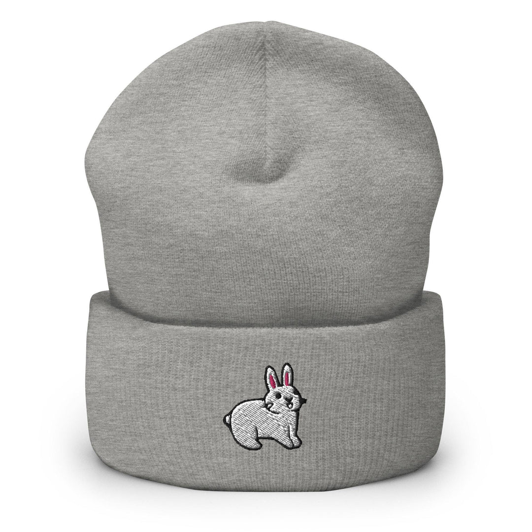 a grey beanie with a white rabbit on it