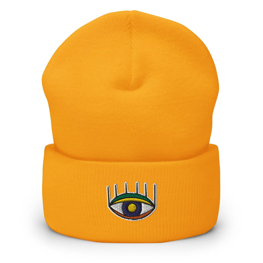 a yellow beanie with an eye on it