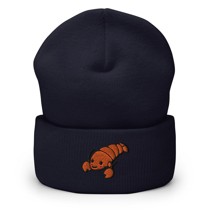 a blue beanie with an orange fish embroidered on it