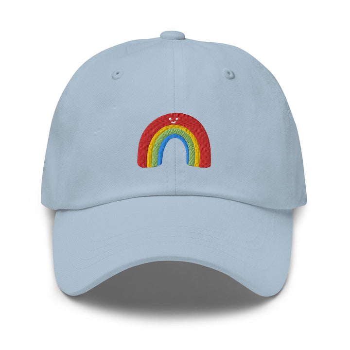 a light blue hat with a rainbow embroidered on the front