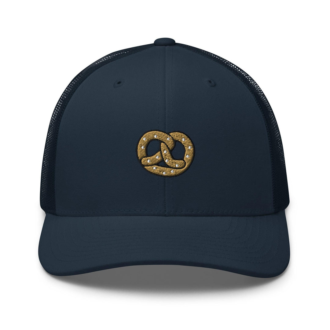 a blue hat with a gold knot on the front