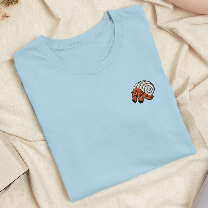 a blue t - shirt with a picture of a snail on it
