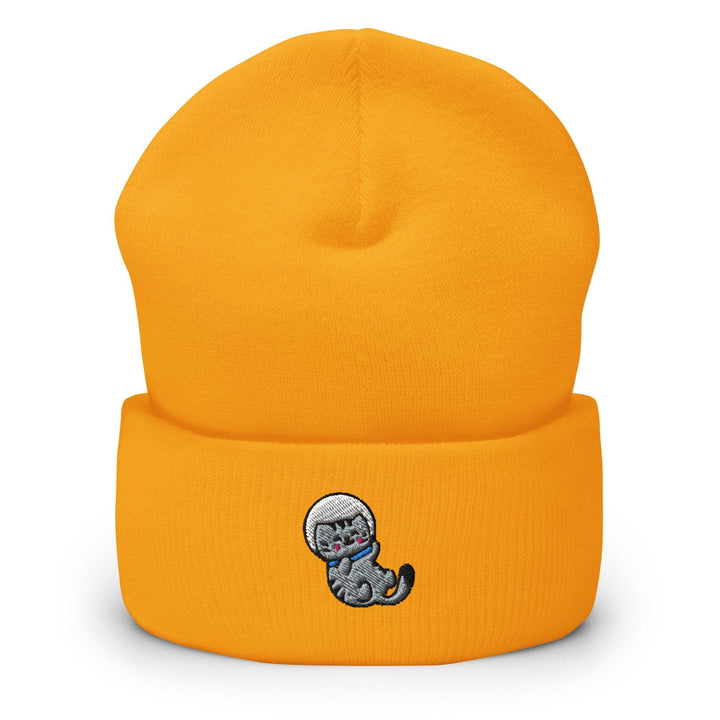 a yellow beanie with a cartoon cat on it