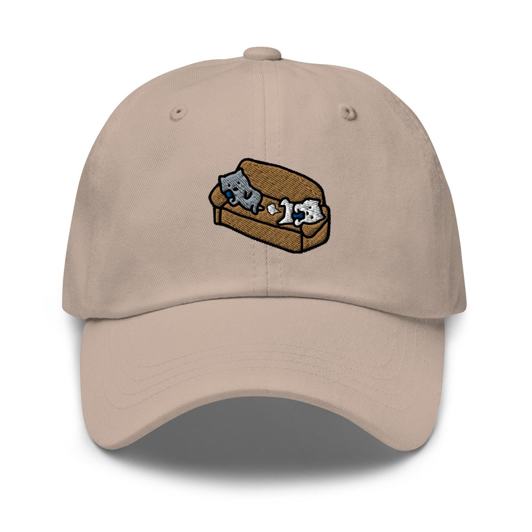 a baseball cap with a picture of two cats on a piece of bread