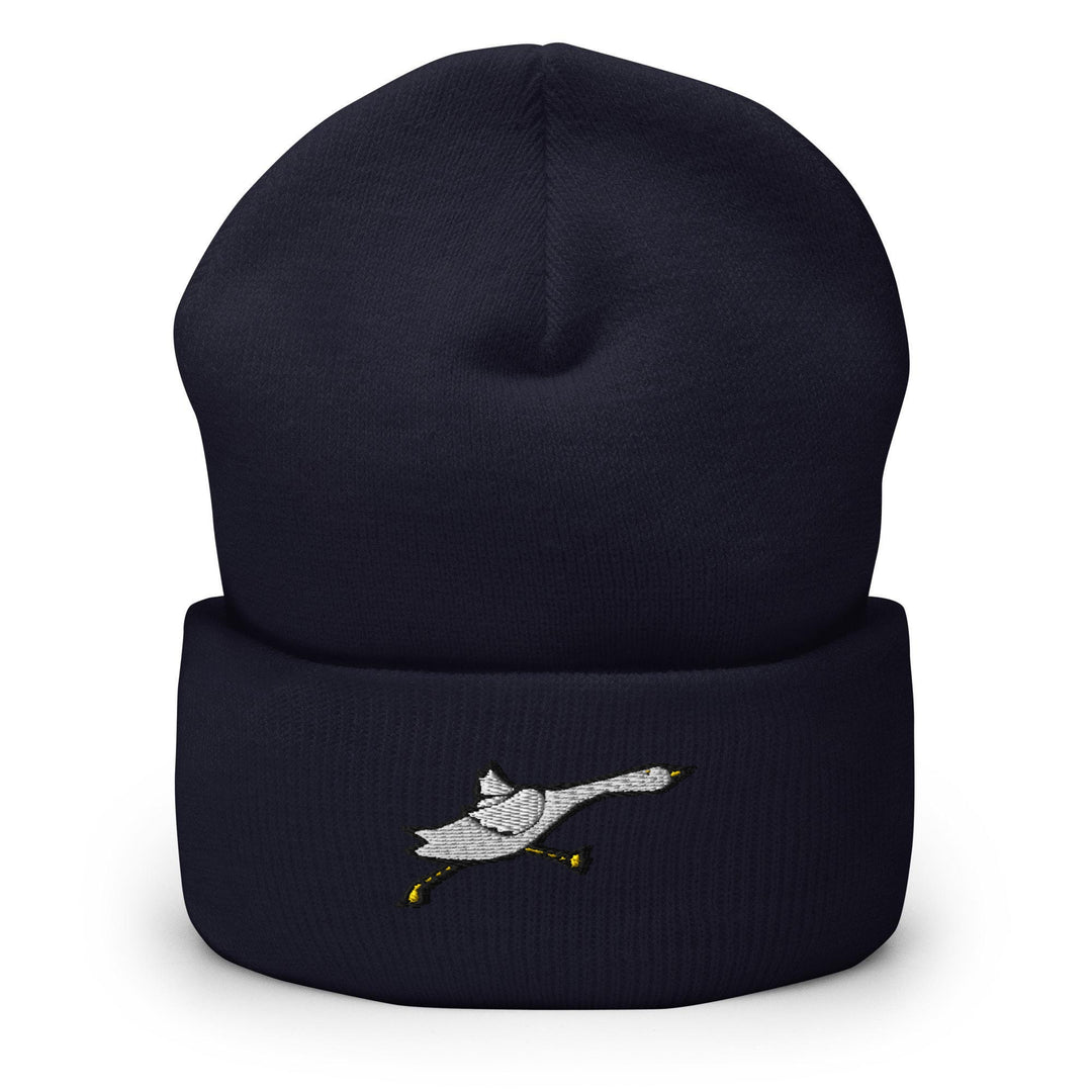 a black beanie with a white bird on it
