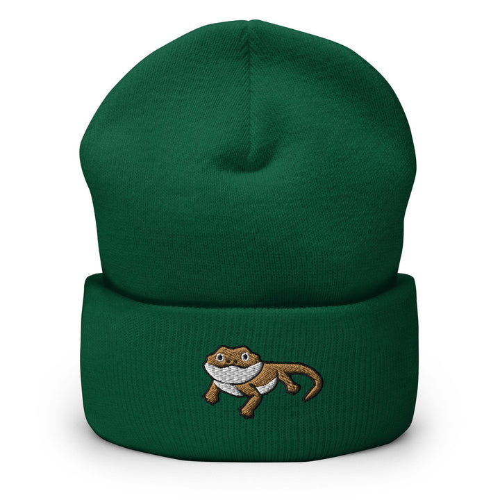 a green beanie with a monkey on it