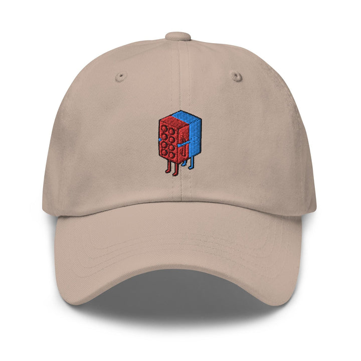 a beige hat with a red and blue object on it