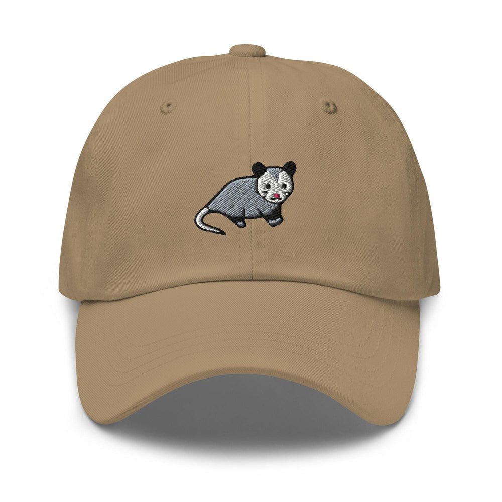 a tan hat with a cartoon animal on it