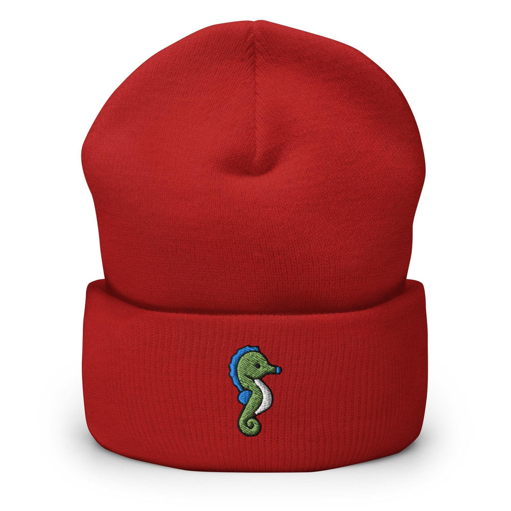 a red beanie with a seahorse embroidered on it