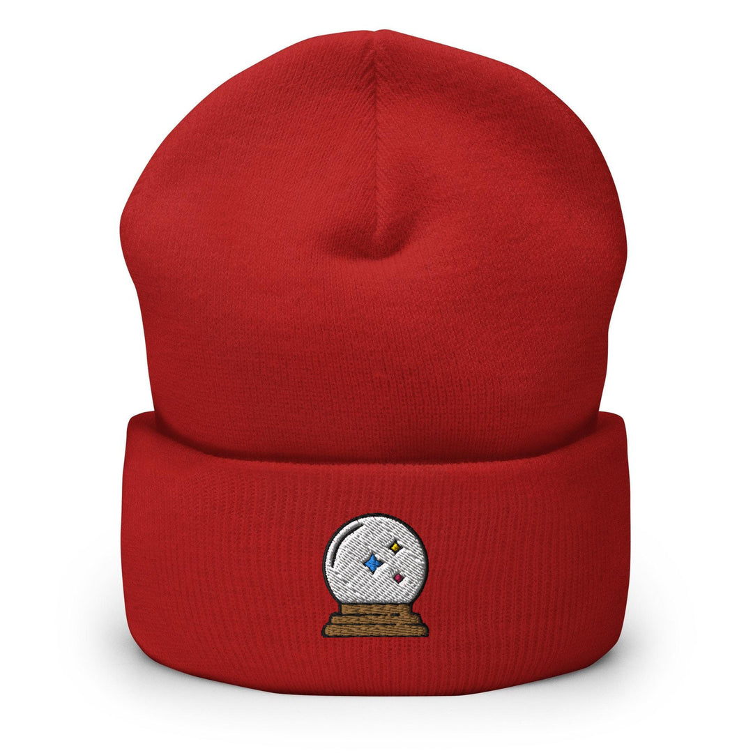 a red beanie with a white snow globe on it