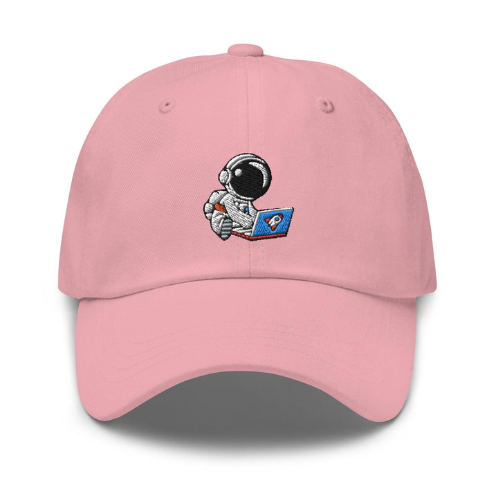 a pink hat with an astronaut reading a book