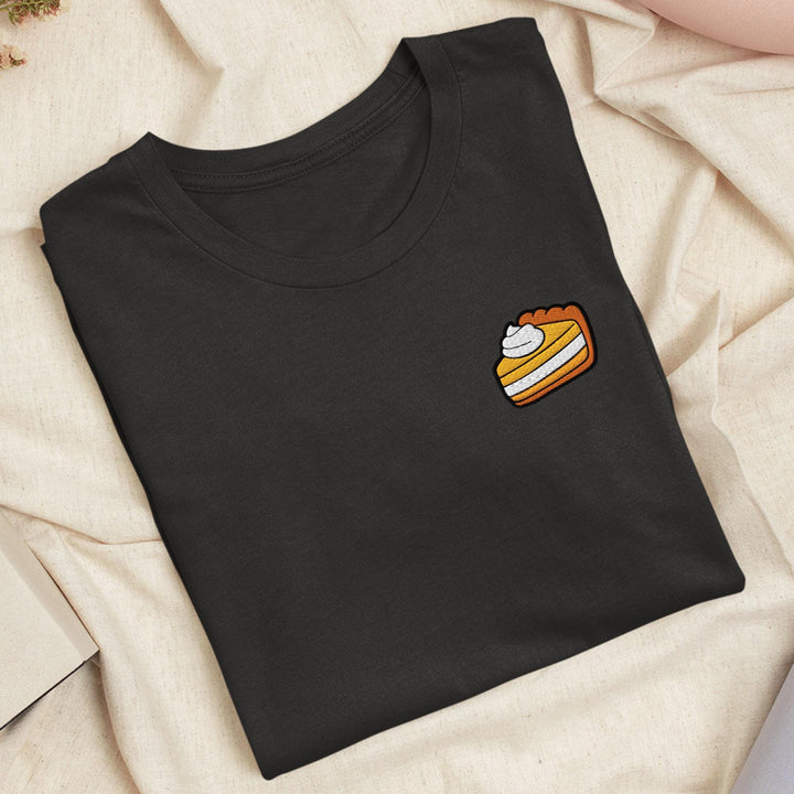 a black shirt with a piece of cake on it