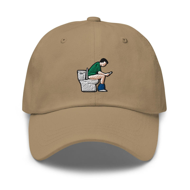 a baseball cap with a drawing of a man sitting on a toilet
