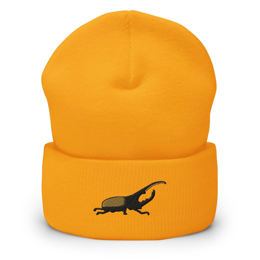 a yellow hat with a black lizard on it