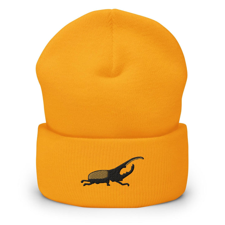 a yellow hat with a black lizard on it