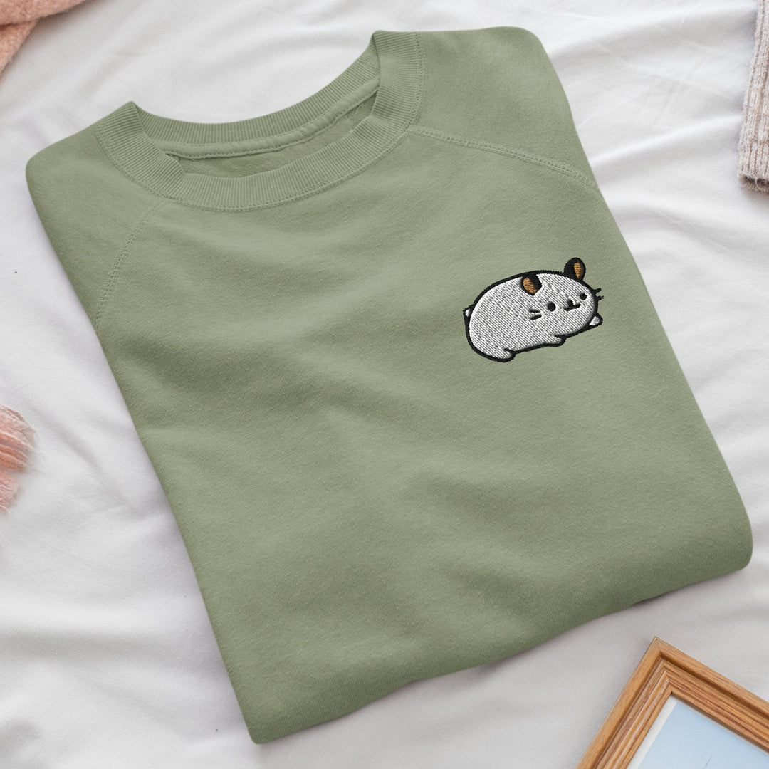 a green t - shirt with a picture of a cow on it