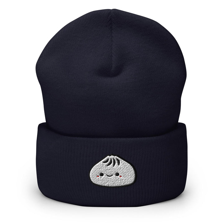 a black beanie with a white face on it