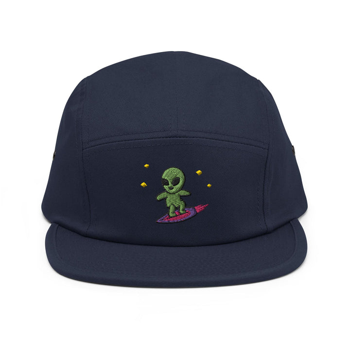 a blue hat with a green alien on it