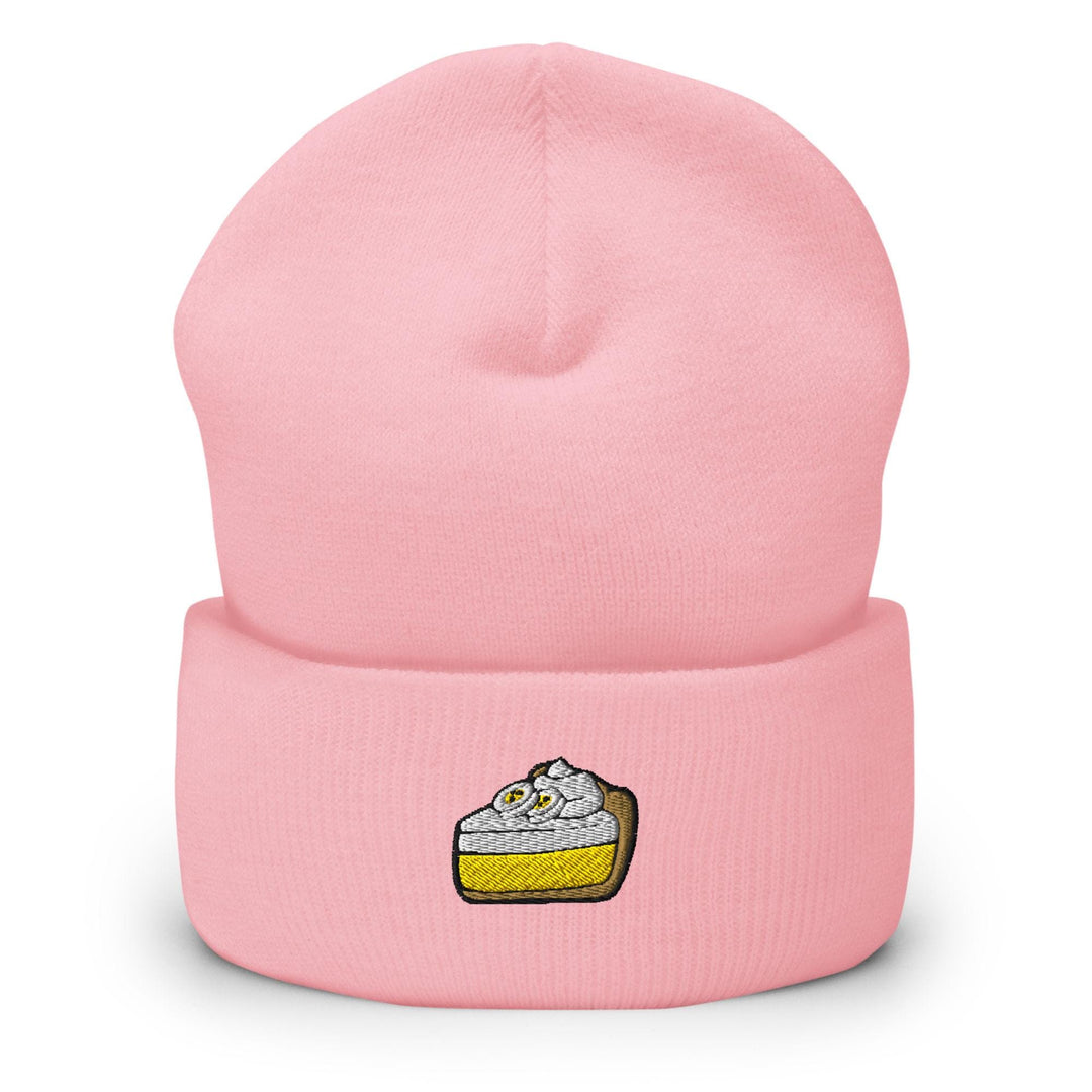 a pink beanie hat with a piece of cake on it