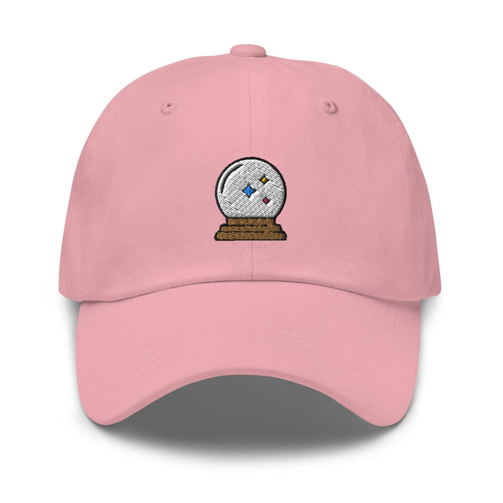 a pink hat with a snow globe on it
