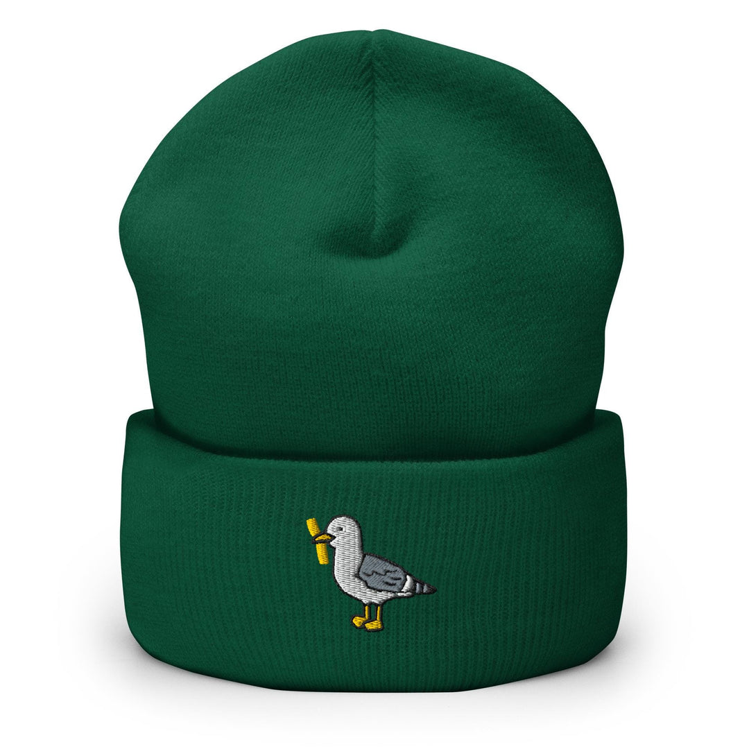 a green beanie with a bird embroidered on it