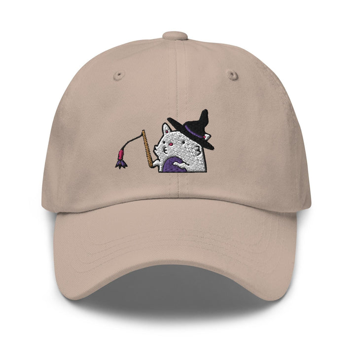 a baseball cap with a white cat wearing a witches hat