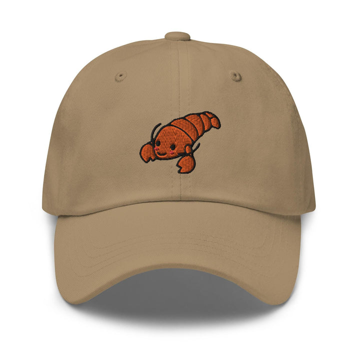 a khaki colored baseball cap with a fish embroidered on the front