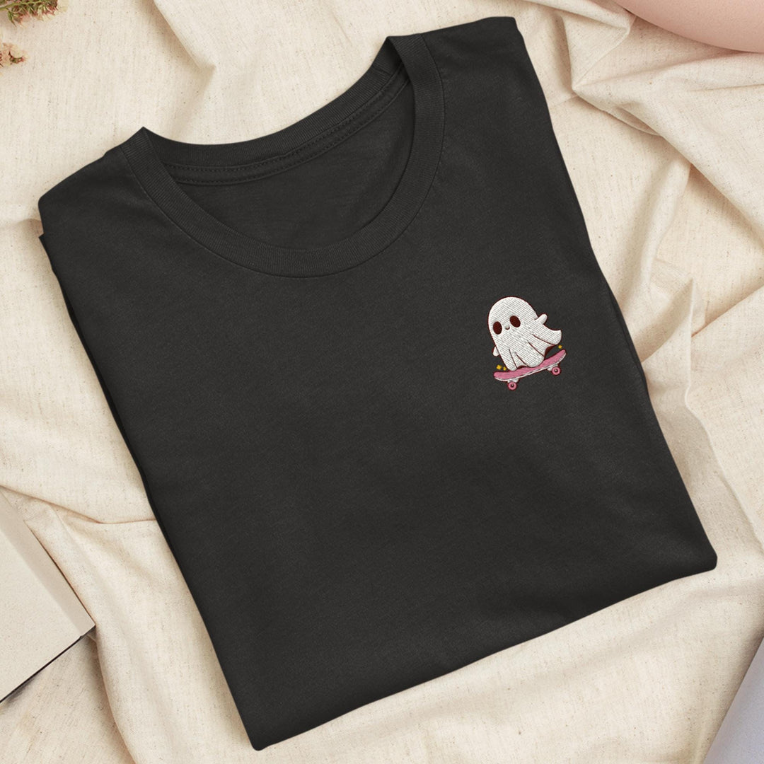 a black t - shirt with a white ghost on it