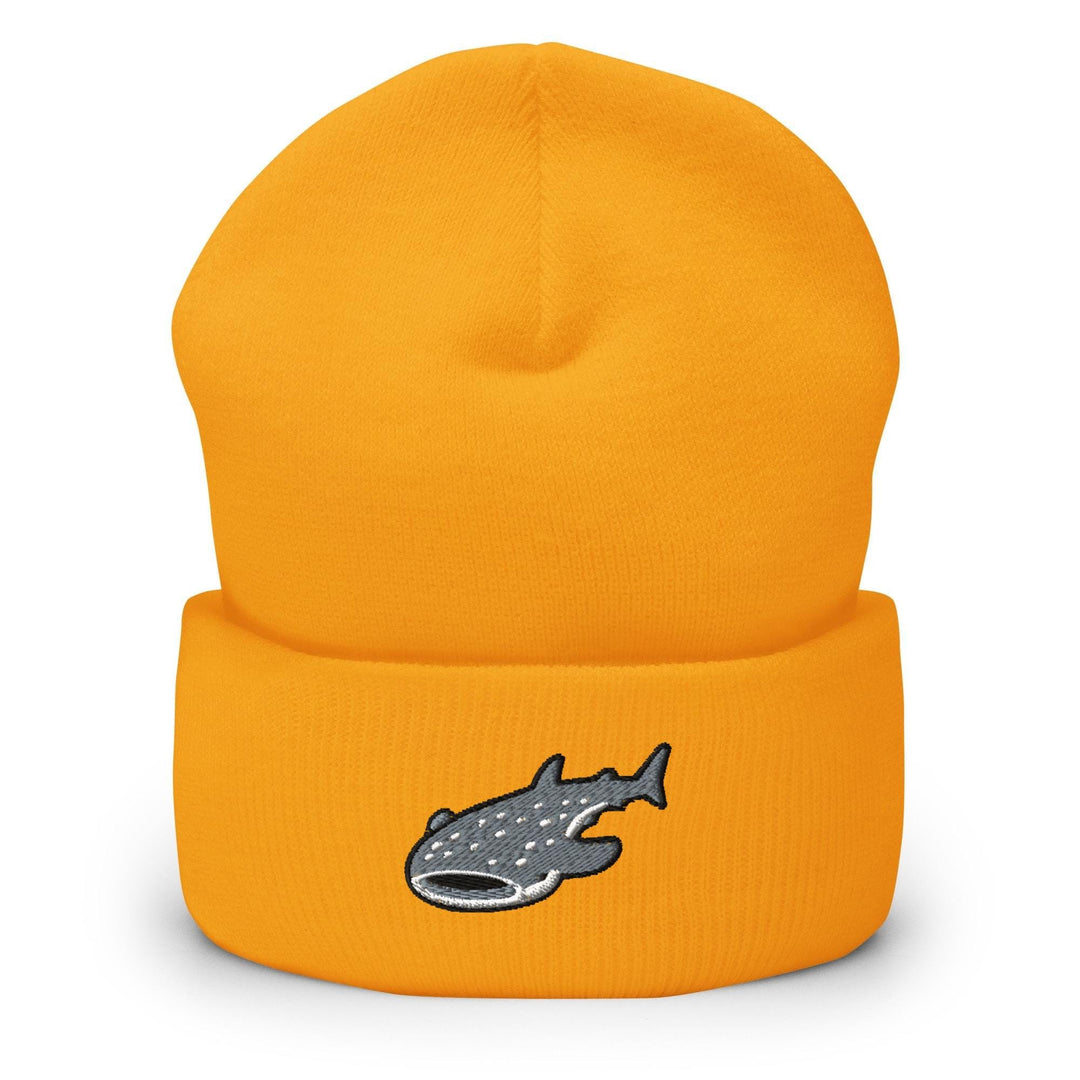 a yellow beanie with a fish embroidered on it