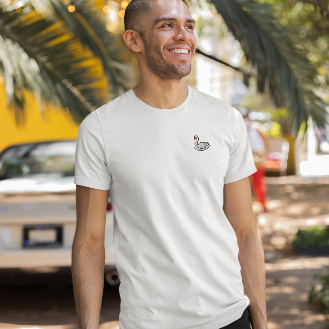 a man in a white t - shirt smiles at the camera