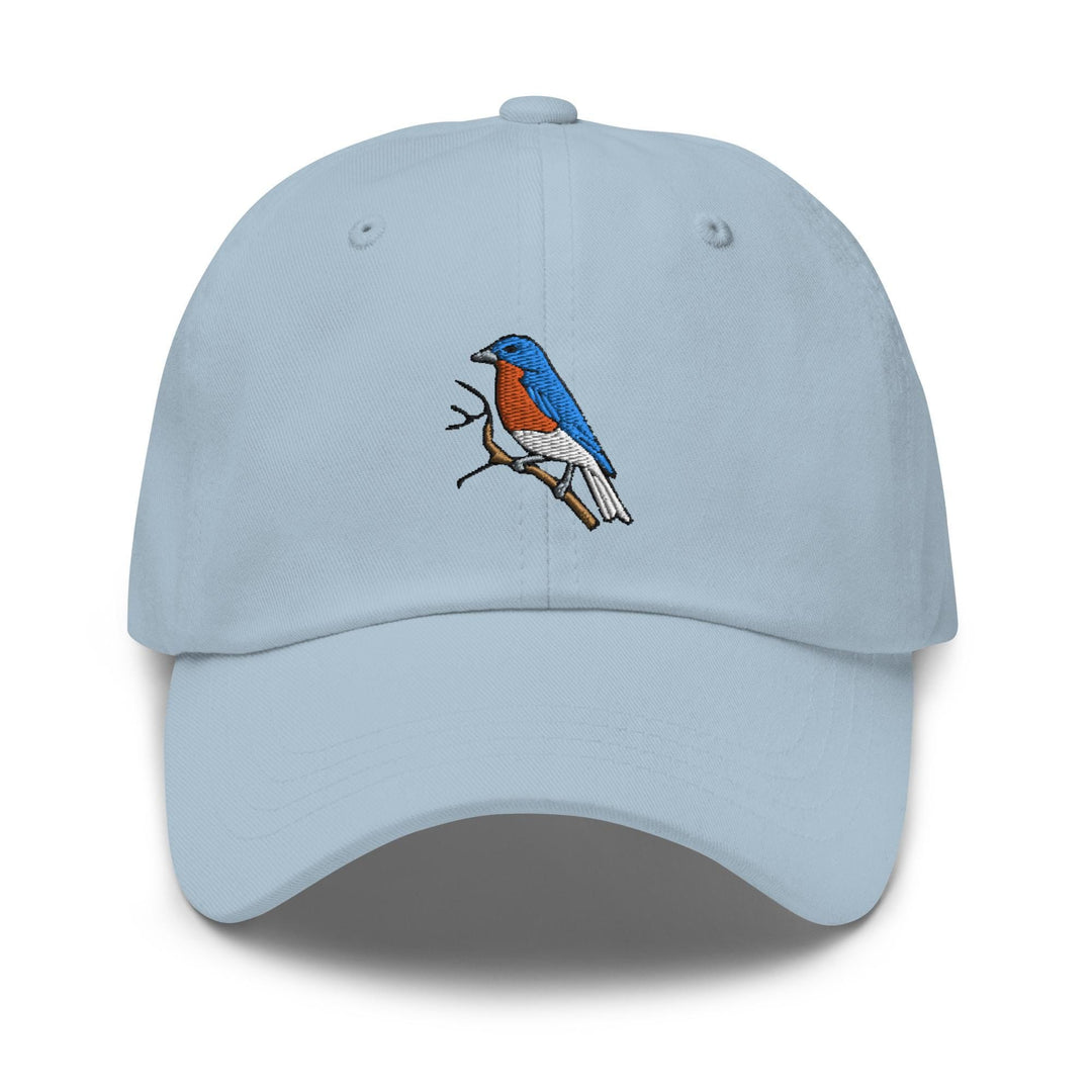a light blue hat with a bird on it