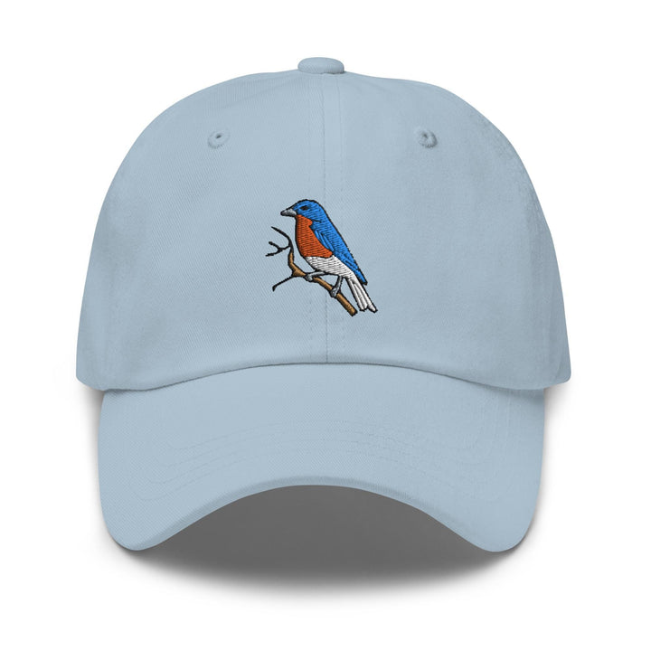 a light blue hat with a bird on it