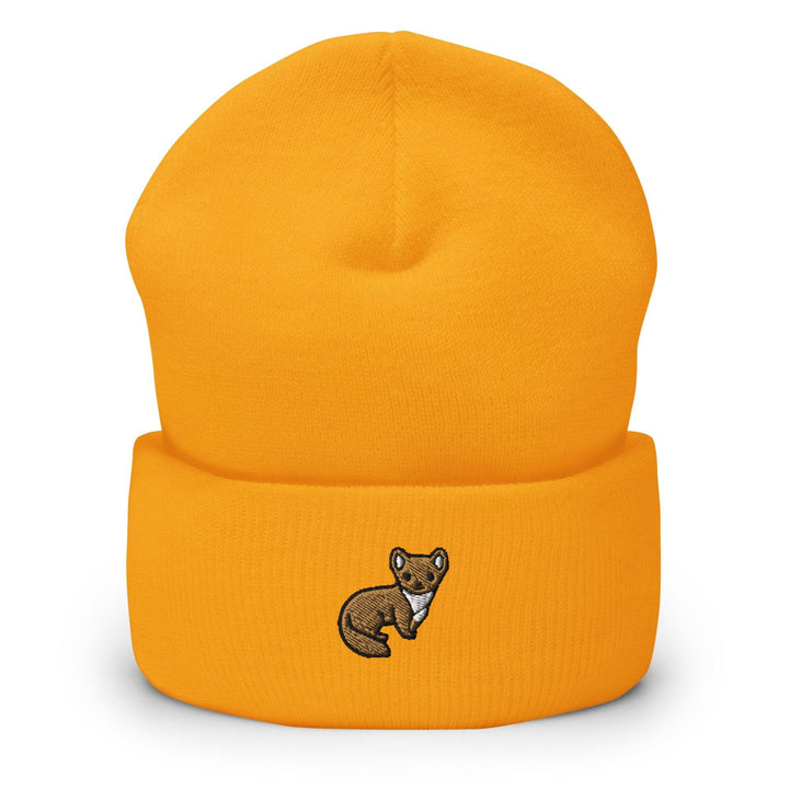 a yellow beanie with a brown bear embroidered on it