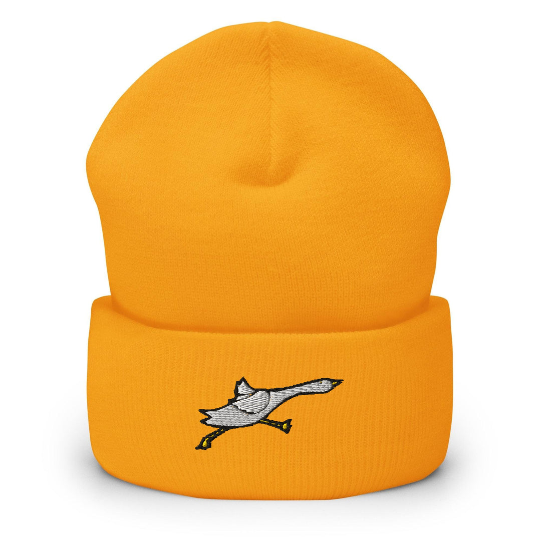 a yellow hat with a bird on it