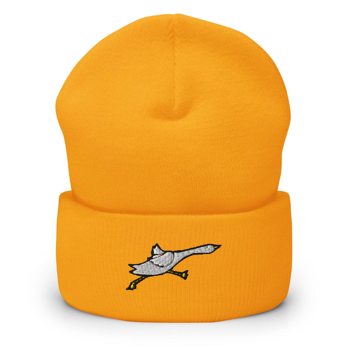 a yellow hat with a bird on it