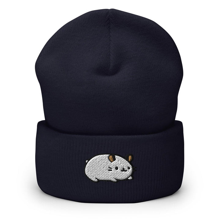 a black beanie with a white animal on it
