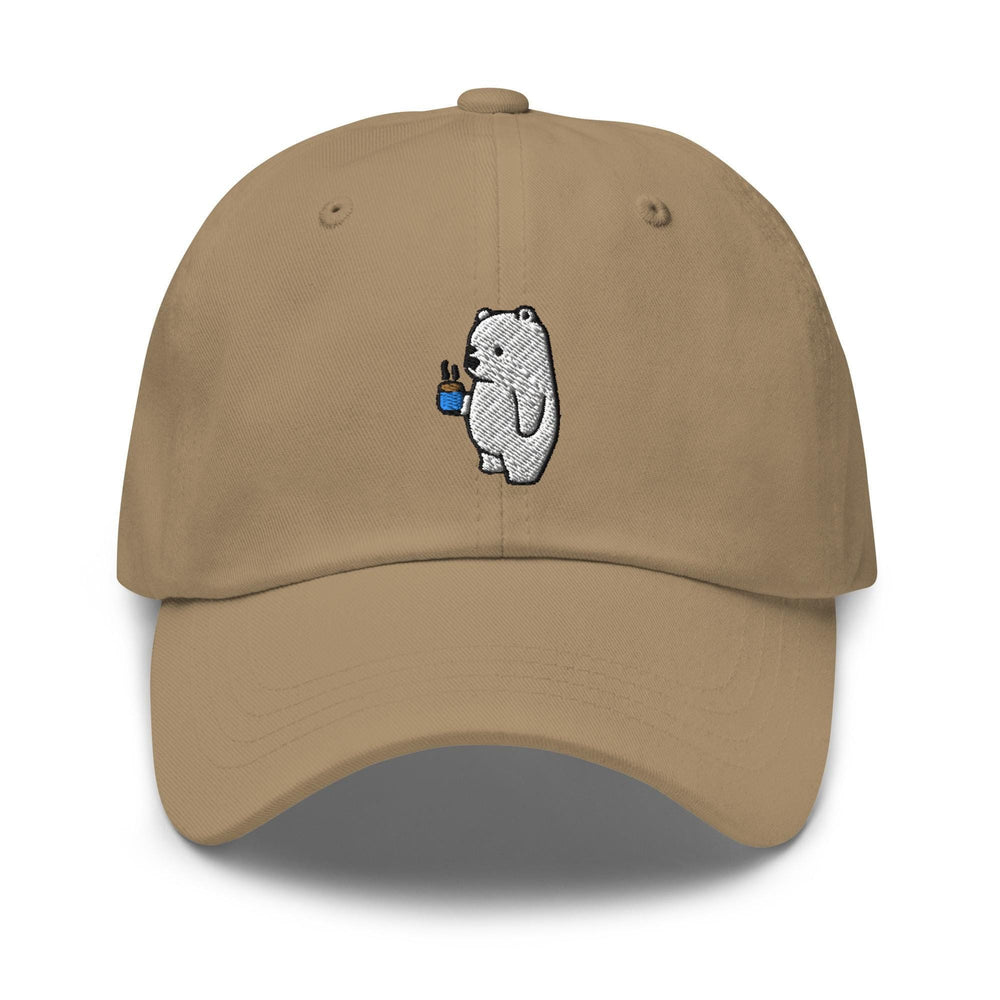 a tan hat with a white bear holding a blue cup