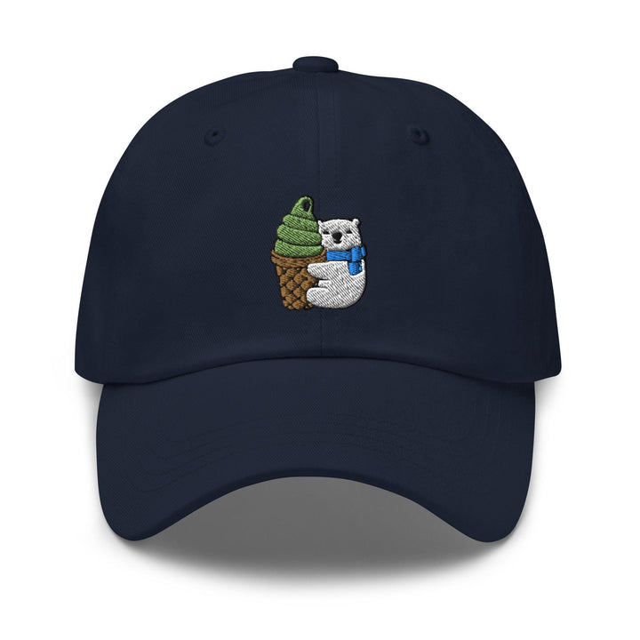 a baseball cap with a bear holding a pine cone