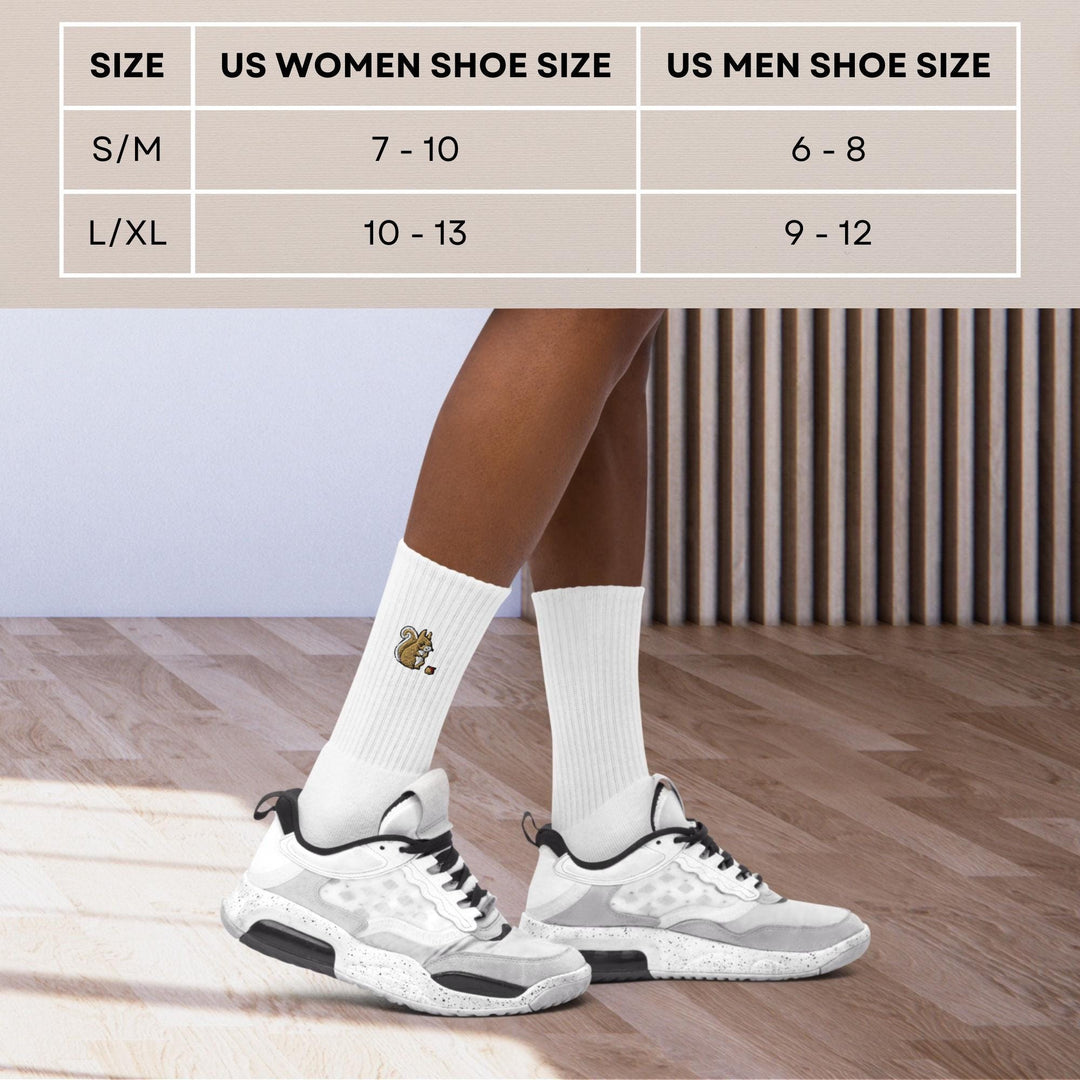a woman&#39;s feet in white shoes with a white sock