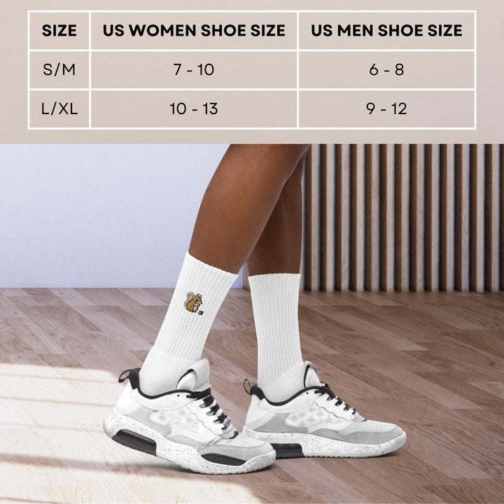a woman&#39;s feet in white shoes with a white sock