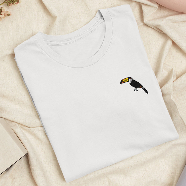 a white t - shirt with a black and yellow bird on it