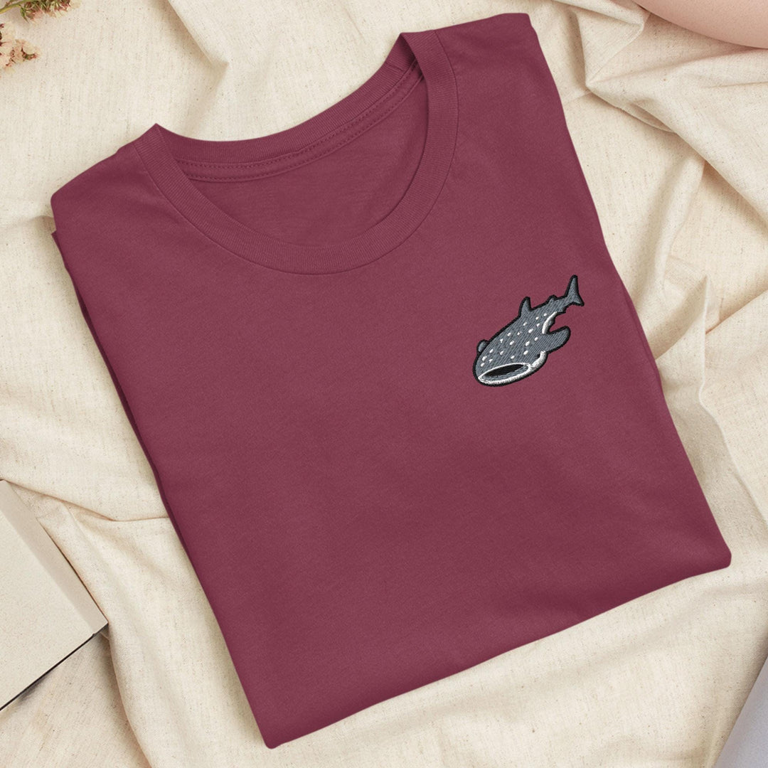 a t - shirt with a picture of a fish on it