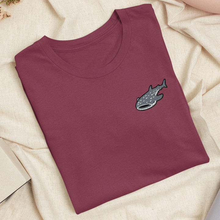 a t - shirt with a picture of a fish on it